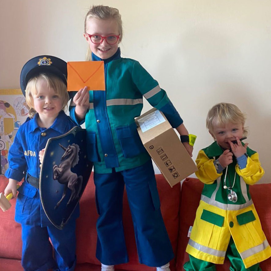 a family group of children in career costumes